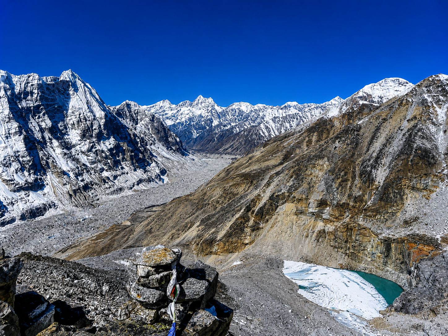 Panoramic view of snow-covered Himalayan peaks and glacier during the Kanchenjunga Circuit Trek in eastern Nepal.