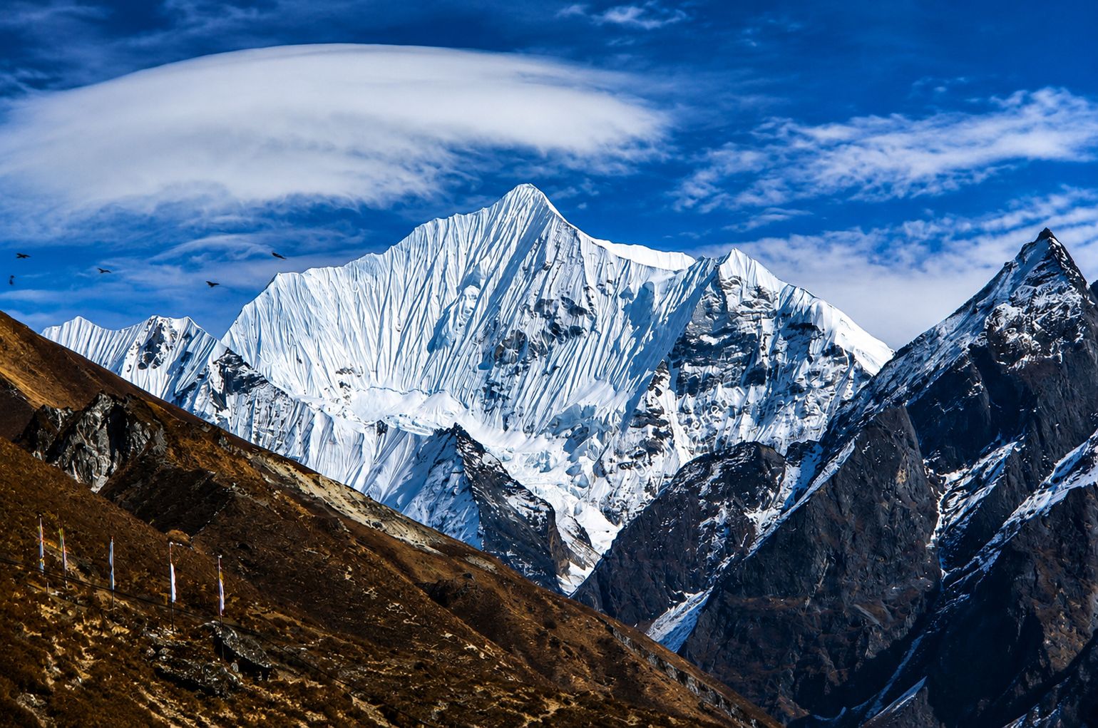 Panoramic view of Yala Peak and surrounding snow-covered Himalayan mountains during a Yala Peak climbing expedition in Nepal.