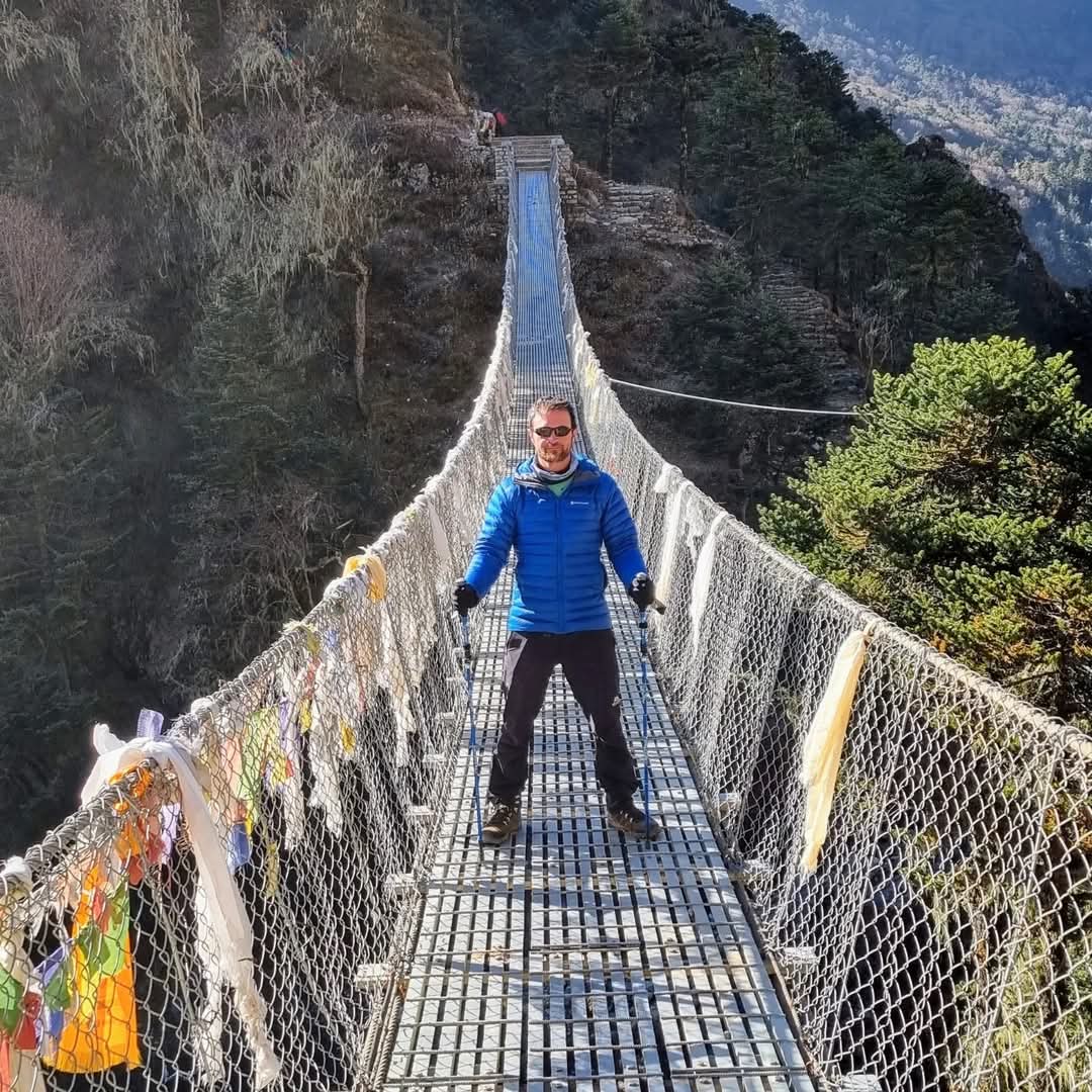 Trekkers in suspension bridge